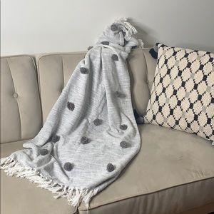 Gray and white Pom Pom‎ fringe throw